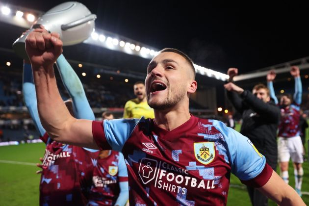 Taylor Harwood-Bellis celebrates winning the Championship with Burnley