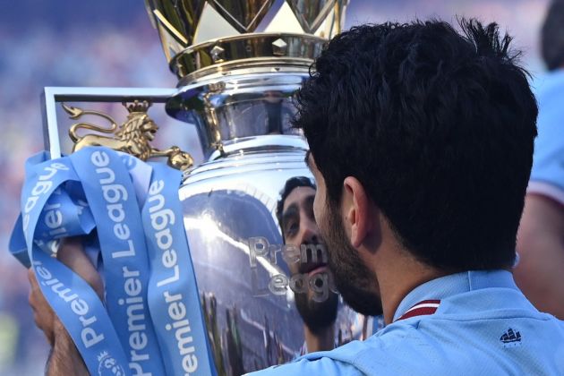 Ilkay Gundogan with the Premier League trophy after securing the title with a 1-0 victory over Chelsea at the Etihad
