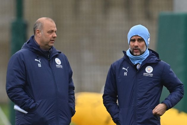 Rodolfo Borrell and Pep Guardiola during Manchester City training