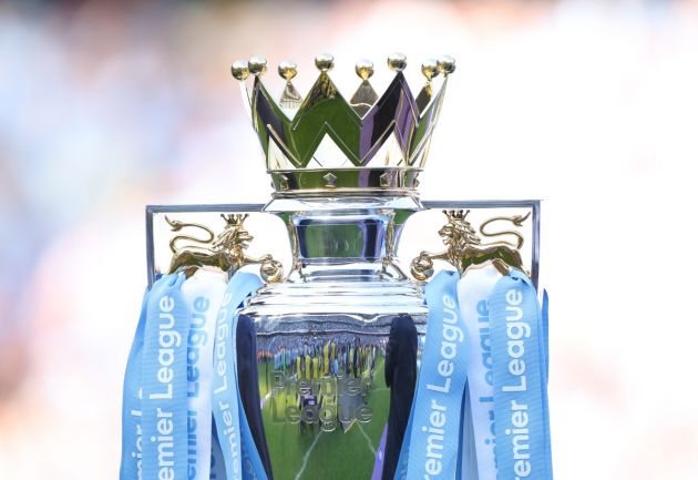 Premier League trophy in Manchester City ribbons