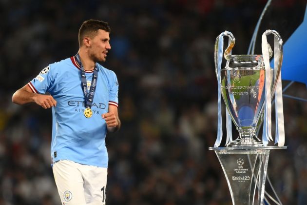 Rodri eyes up his Champions League trophy