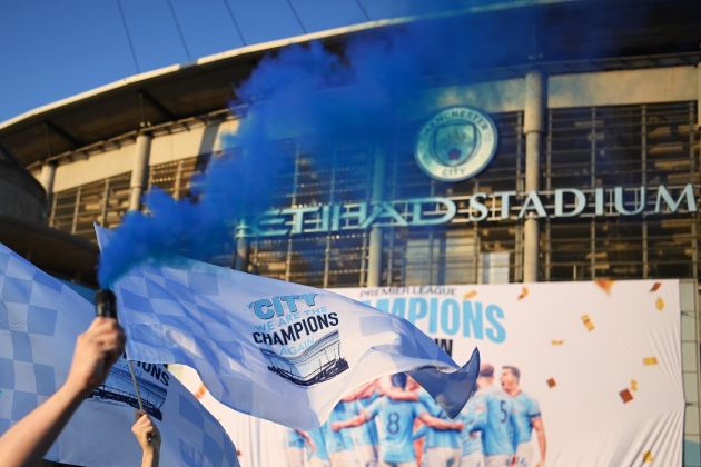 City fans celebrate outside of the Etihad