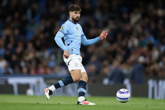 Who should partner Ruben Dias in defence for City in the Manchester derby?