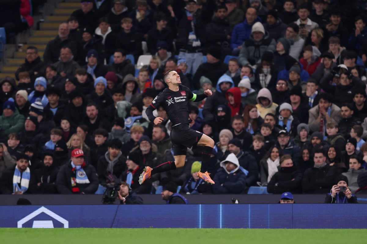 Alex Grimaldo celebrates giving Bayer Leverkusen the lead over Manchester City.